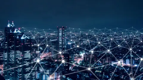 Verlichte stad met een netwerk van verbindingen, symbool voor zakelijk internet en glasvezel in Dordrecht