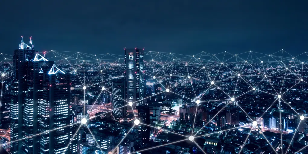 Verlichte stad met een netwerk van verbindingen, symbool voor zakelijk internet en glasvezel in Dordrecht